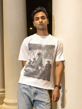 Model wearing Vintage Cowboy Regular Fit T-Shirt during night outdoor photoshoot