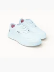 White low-top casual sneakers for men lifestyle view