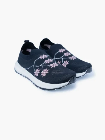 Pair of navy floral knit slip-on walking shoes for women with white soles, shown in a front angled view.