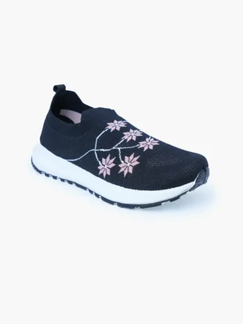 Single Black floral knit slip-on walking shoe for women in front-side view with white midsole.