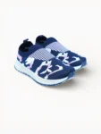 Pair of women’s navy slip‑on sport shoes with pastel knit design, light cushioned sole and blue outsole, angled front view.